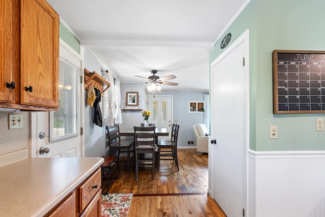 45 Cohas Ave, Manchester, NH 03109 - dining space with wood finished floors, ceiling fan, ornamental molding, and a wainscoted wall