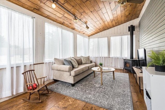 85 Lee Ave, Manchester, NH 03109 - sunroom / solarium with a wood stove, vaulted ceiling, track lighting, wood ceiling, and hardwood / wood-style floors