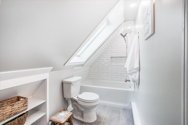 85 Lee Ave, Manchester, NH 03109 - bathroom featuring toilet, a skylight, shower / bathtub combination, vaulted ceiling, and baseboards
