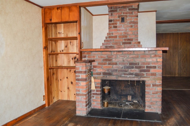 170 Brown Rd, Harrisville, NH 03450 - detailed view of wood finished floors, ornamental molding, a brick fireplace, baseboards, and a textured wall