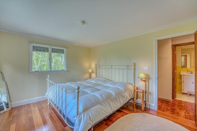 394 Sunset Hill Rd, Sugar Hill, NH 03586 - bedroom with wood finished floors, crown molding, and baseboards