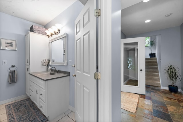 110 Heights Rd, Gilford, NH 03249 - bathroom with baseboards, vanity, a chandelier, recessed lighting, and stone tile floors