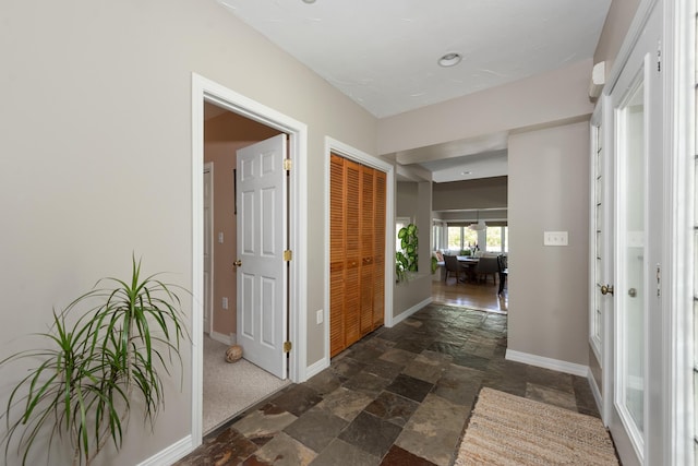 110 Heights Rd, Gilford, NH 03249 - hallway with stone tile floors and baseboards