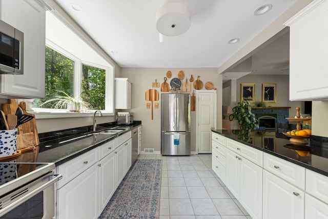 110 Heights Rd, Gilford, NH 03249 - kitchen featuring appliances with stainless steel finishes, a sink, white cabinetry, and recessed lighting
