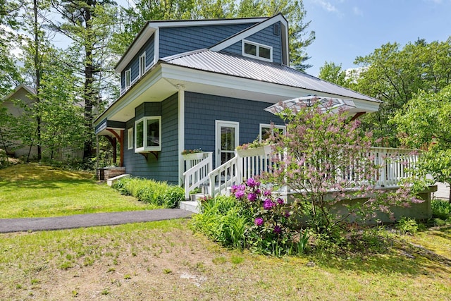 110 Heights Rd, Gilford, NH 03249 - view of front facade with a front yard and metal roof