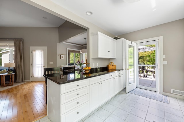 110 Heights Rd, Gilford, NH 03249 - kitchen featuring baseboards, white cabinetry, and a peninsula