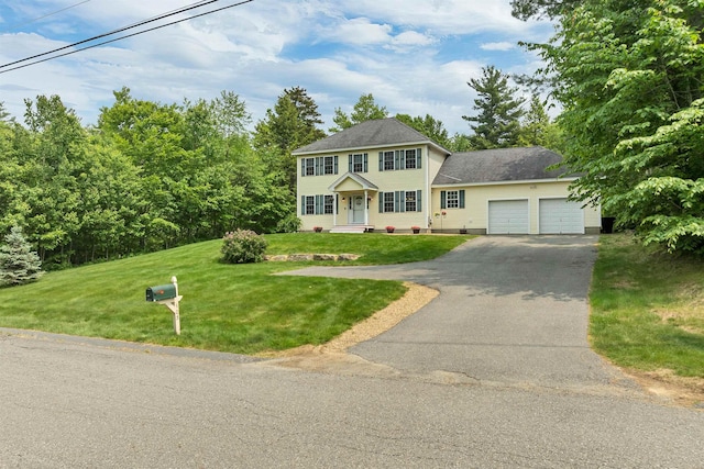 103 Green Farm Rd, New Ipswich, NH 03071 - colonial-style house with a garage, asphalt driveway, and a front lawn