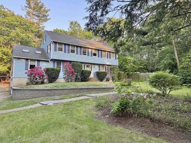 93 Faith Dr, Hampstead, NH 03841 - colonial-style house featuring a front yard and a chimney