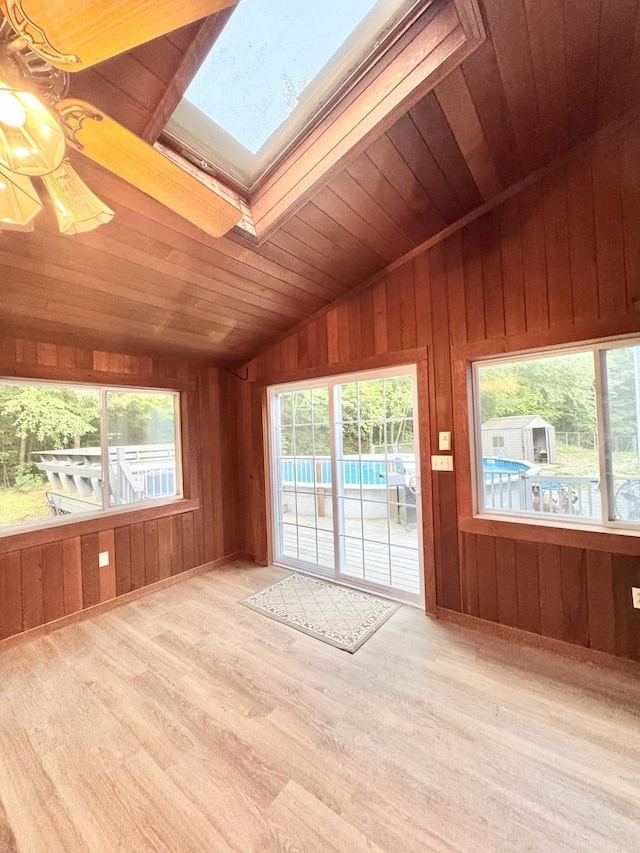 93 Faith Dr, Hampstead, NH 03841 - spare room featuring a skylight, vaulted ceiling, wood ceiling, wood finished floors, and wood walls
