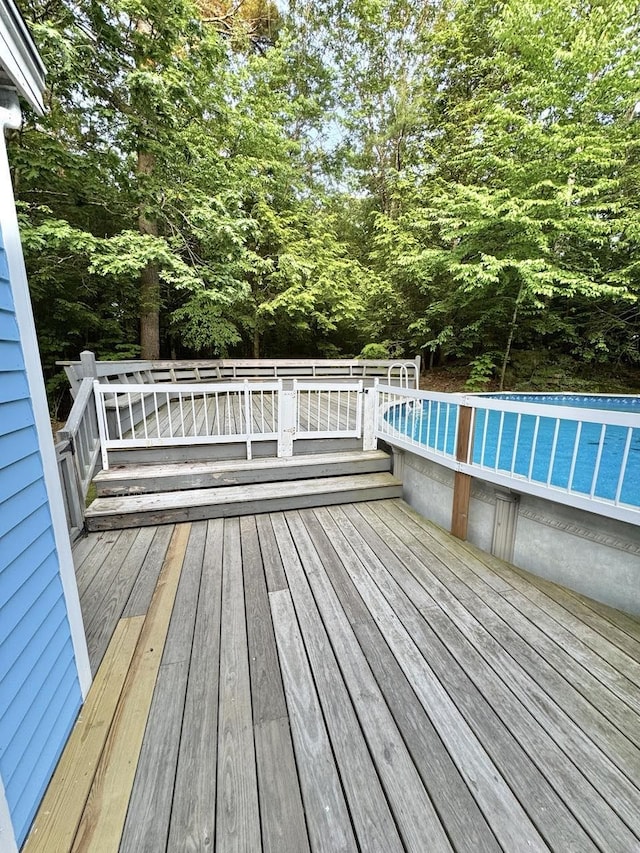 93 Faith Dr, Hampstead, NH 03841 - wooden deck with an outdoor pool