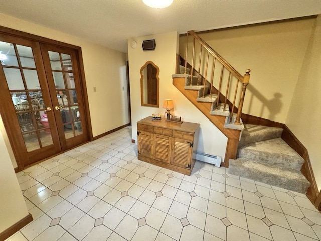 93 Faith Dr, Hampstead, NH 03841 - stairway with a baseboard heating unit, french doors, and baseboards