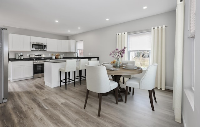 319 Mechanic St, Laconia, NH 03246 - dining area featuring light wood-style floors and recessed lighting