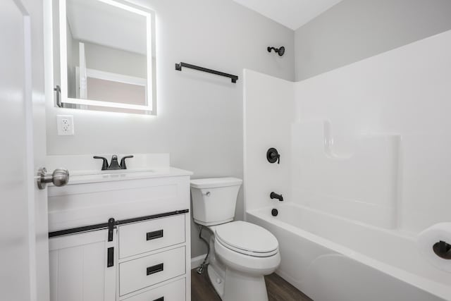 319 Mechanic St, Laconia, NH 03246 - full bathroom with toilet, wood finished floors, vanity, and bathtub / shower combination