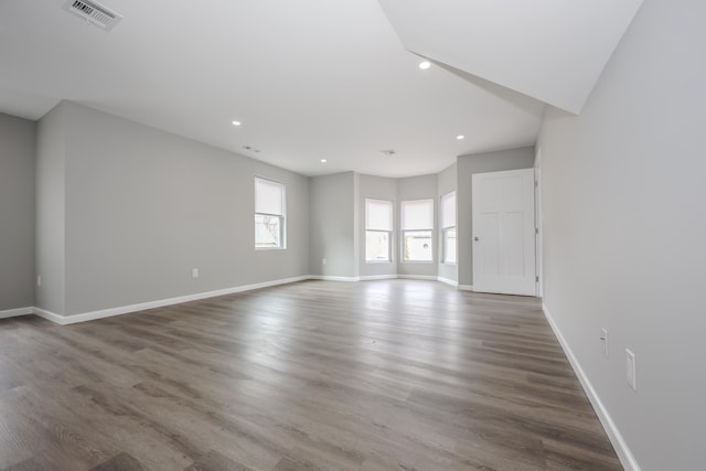 319 Mechanic St, Laconia, NH 03246 - unfurnished living room featuring recessed lighting, baseboards, and wood finished floors