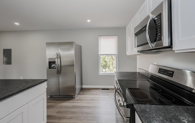 319 Mechanic St, Laconia, NH 03246 - kitchen with stainless steel appliances, electric panel, white cabinets, and recessed lighting