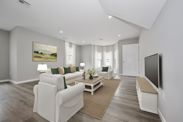 319 Mechanic St, Laconia, NH 03246 - living room with recessed lighting, baseboards, and wood finished floors