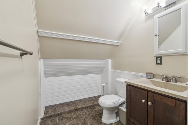 19 Wendy Dr, Alton, NH 03810 - bathroom with vanity, toilet, wainscoting, and stone finish flooring