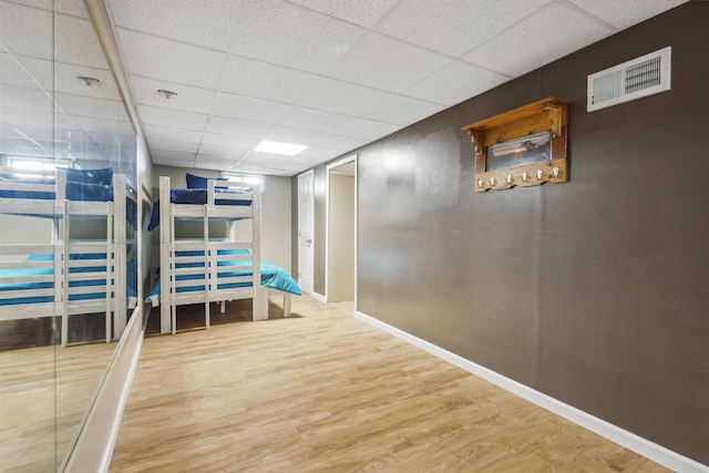 19 Wendy Dr, Alton, NH 03810 - hall with a drop ceiling, wood finished floors, and baseboards