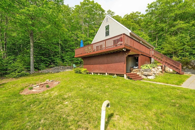 19 Wendy Dr, Alton, NH 03810 - view of front of house with a deck, a front lawn, and stairway