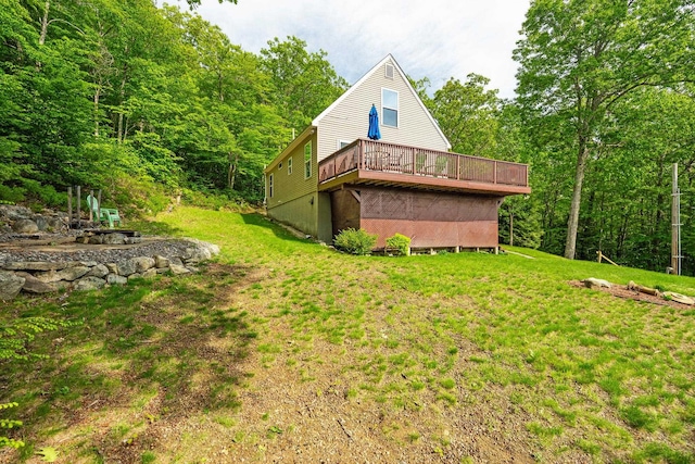 19 Wendy Dr, Alton, NH 03810 - view of home's exterior featuring a lawn, a wooden deck, and a forest view