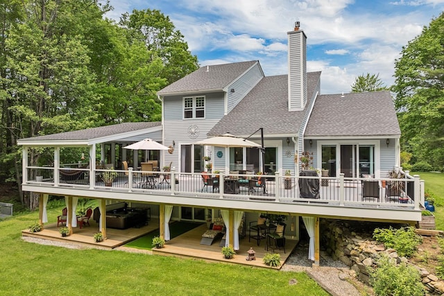 52 Meadow Ln, Belmont, NH 03220 - back of house with a deck, outdoor dining area, a shingled roof, a yard, and a chimney