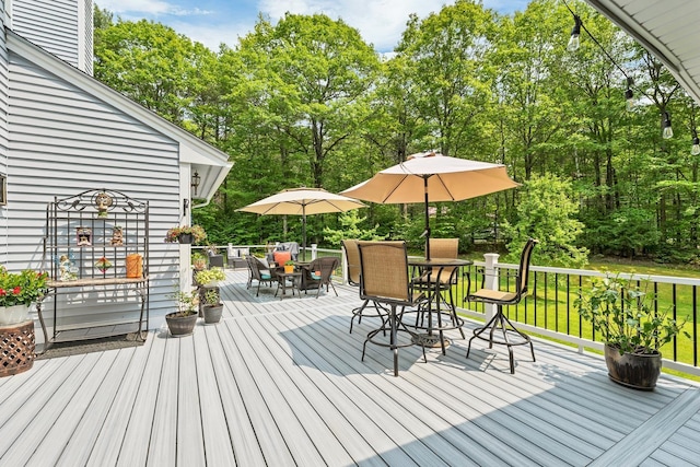 52 Meadow Ln, Belmont, NH 03220 - wooden terrace with outdoor dining space and view of scattered trees