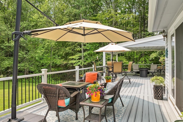 52 Meadow Ln, Belmont, NH 03220 - wooden deck with a fire pit, outdoor dining space, and a lawn