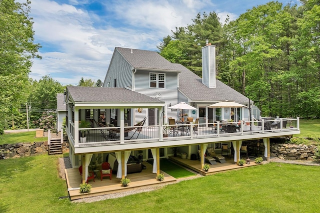 52 Meadow Ln, Belmont, NH 03220 - rear view of property with a wooden deck, a shingled roof, and a chimney