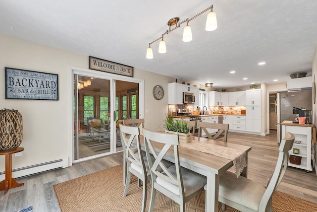 52 Meadow Ln, Belmont, NH 03220 - dining room featuring light wood-style floors, baseboard heating, and recessed lighting