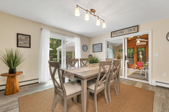 52 Meadow Ln, Belmont, NH 03220 - dining area featuring wood finished floors, french doors, and baseboard heating