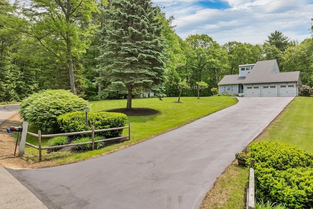 52 Meadow Ln, Belmont, NH 03220 - view of home's community featuring driveway, a lawn, a garage, and a view of trees
