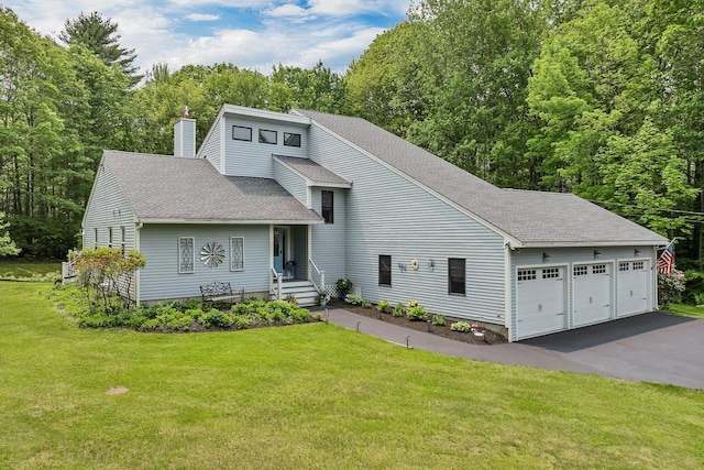 52 Meadow Ln, Belmont, NH 03220 - view of front of property with roof with shingles, a chimney, a front lawn, and a garage