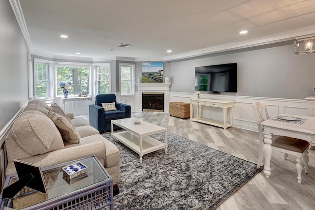 3 Sterling Hill Ln Unit 324, Exeter, NH 03833 - living room with crown molding, wood finished floors, a fireplace, wainscoting, and recessed lighting