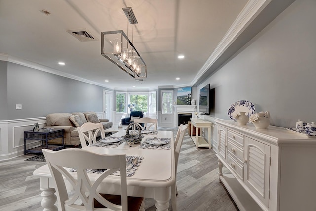 3 Sterling Hill Ln Unit 324, Exeter, NH 03833 - dining area featuring crown molding, wainscoting, a fireplace, recessed lighting, and a decorative wall