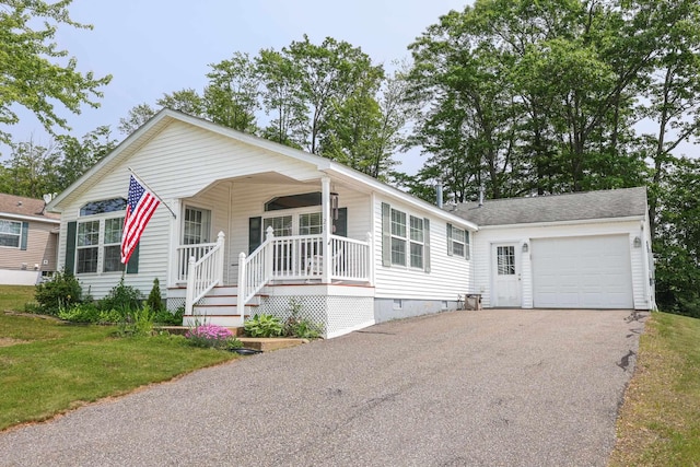 21 Mountain View Dr Unit 21, Franklin, NH 03235 - view of front of property with a porch, asphalt driveway, crawl space, and a garage