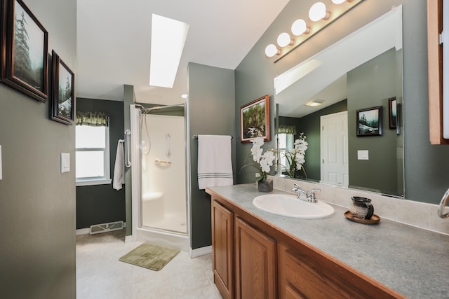 21 Mountain View Dr Unit 21, Franklin, NH 03235 - bathroom with a stall shower, tile patterned flooring, vanity, and a skylight
