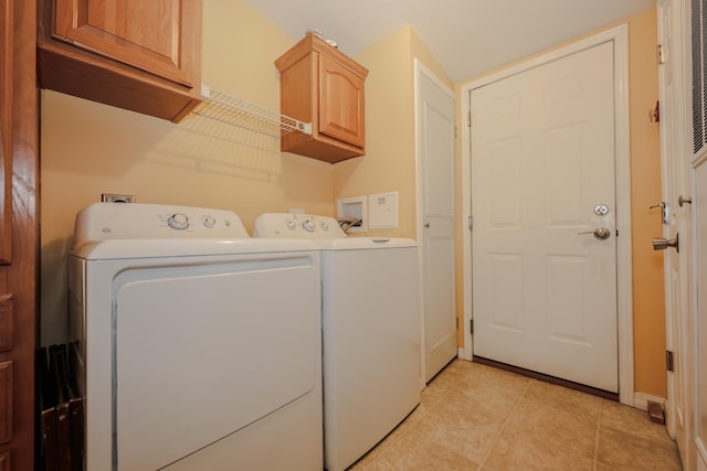21 Mountain View Dr Unit 21, Franklin, NH 03235 - laundry area with washing machine and dryer, cabinet space, light tile patterned flooring, and baseboards