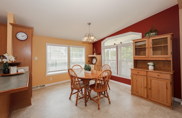 21 Mountain View Dr Unit 21, Franklin, NH 03235 - dining space with baseboards, a chandelier, and lofted ceiling