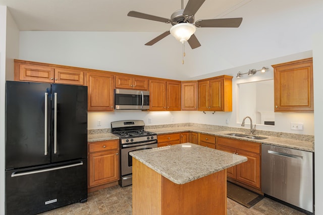 15 Christopher Dr Unit 5, Sandown, NH 03873 - kitchen with stainless steel appliances, a sink, a kitchen island, a ceiling fan, and light stone countertops
