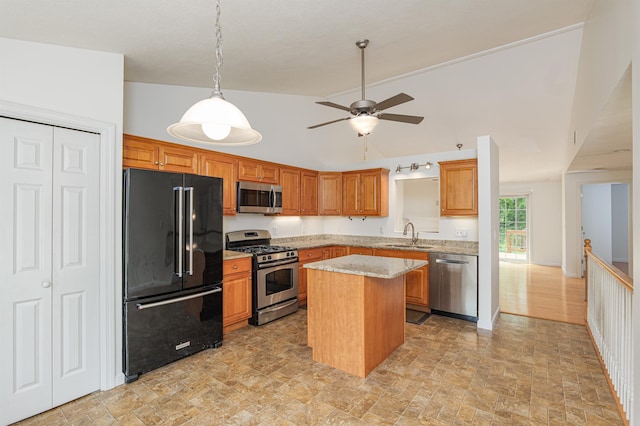 15 Christopher Dr Unit 5, Sandown, NH 03873 - kitchen featuring appliances with stainless steel finishes, vaulted ceiling, a sink, a center island, and a ceiling fan