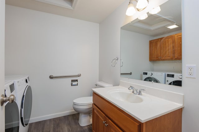 15 Christopher Dr Unit 5, Sandown, NH 03873 - bathroom with separate washer and dryer, toilet, vanity, wood finished floors, and baseboards