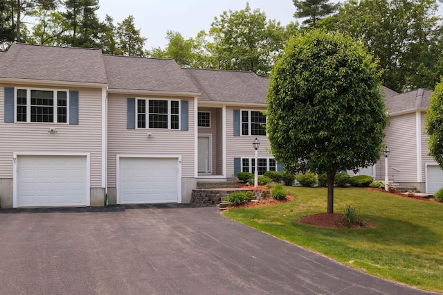 15 Christopher Dr Unit 5, Sandown, NH 03873 - split foyer home featuring asphalt driveway, a front lawn, a garage, and roof with shingles