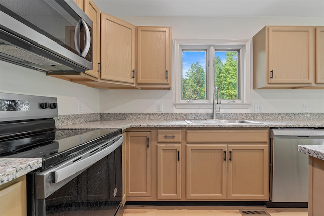 209 Craney Hill Rd, Henniker, NH 03242 - kitchen with appliances with stainless steel finishes, a sink, and light brown cabinetry