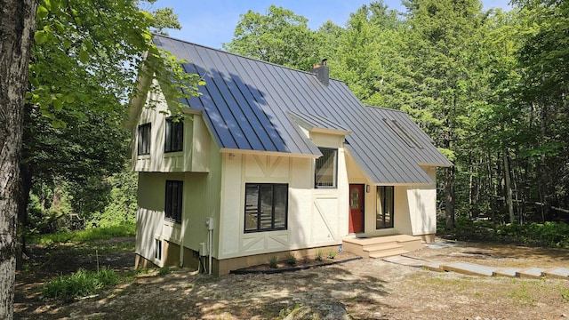 209 Craney Hill Rd, Henniker, NH 03242 - view of front of home featuring a standing seam roof, metal roof, and a chimney