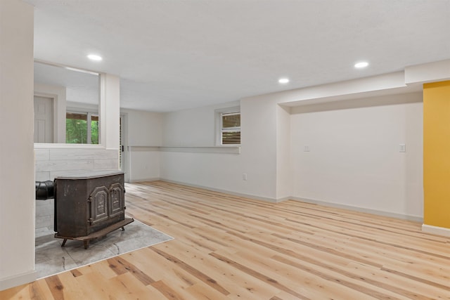 209 Craney Hill Rd, Henniker, NH 03242 - unfurnished living room featuring a wood stove, wood finished floors, recessed lighting, and baseboards