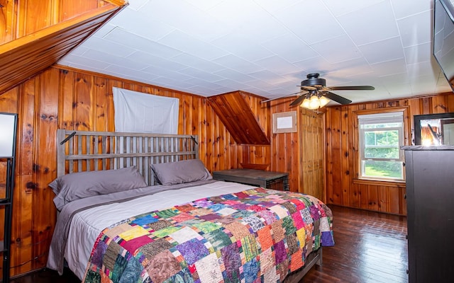 2 E Dunstable Rd, Nashua, NH 03060 - bedroom featuring wood walls, dark wood finished floors, and a ceiling fan