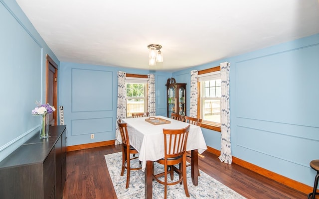 2 E Dunstable Rd, Nashua, NH 03060 - dining area featuring dark wood-style floors and baseboards