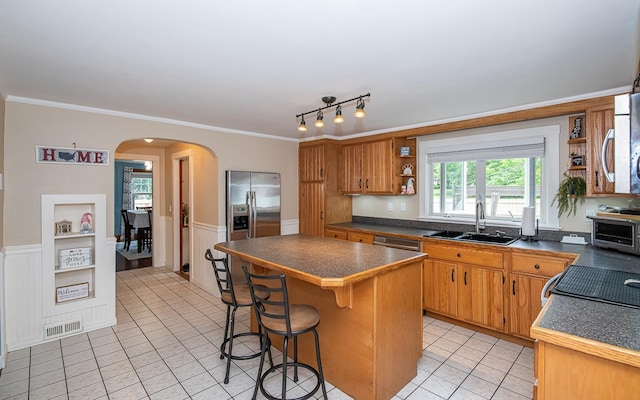 2 E Dunstable Rd, Nashua, NH 03060 - kitchen with open shelves, a sink, dark countertops, light tile patterned floors, and ornamental molding