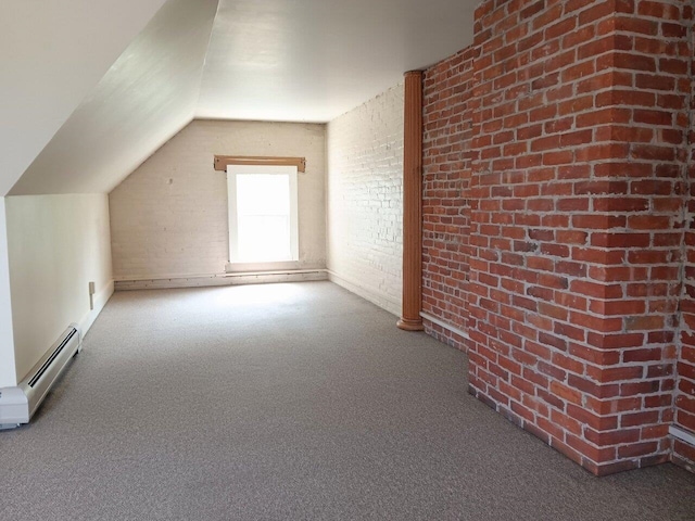 406 Dalton Dr Unit D, Colchester, VT 05446 - additional living space with a baseboard heating unit, brick wall, carpet, and vaulted ceiling
