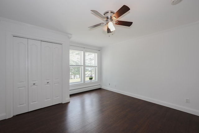 4 Kimberly Dr Unit 4, Merrimack, NH 03054 - unfurnished bedroom with a baseboard radiator, dark wood finished floors, baseboards, crown molding, and a closet